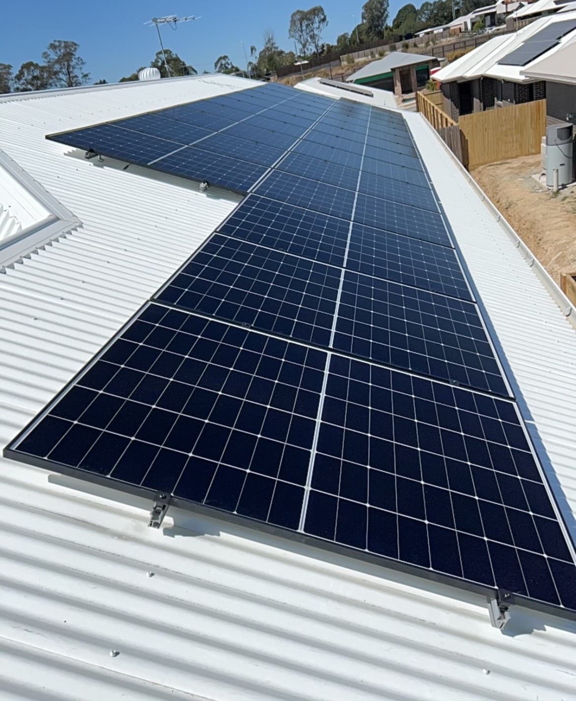 Solar panels installed on a metal roof by TSG Electrical